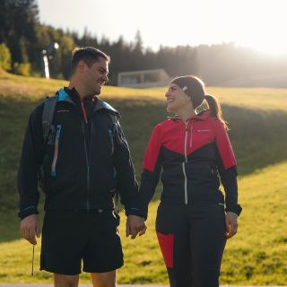 Couple hiking through the mountain landscape of Grossarl in Salzburger Land