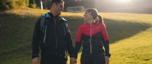 Couple hiking through the mountain landscape of Grossarl in Salzburger Land