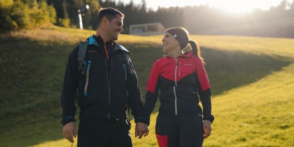 Couple hiking through the mountain landscape of Grossarl in Salzburger Land