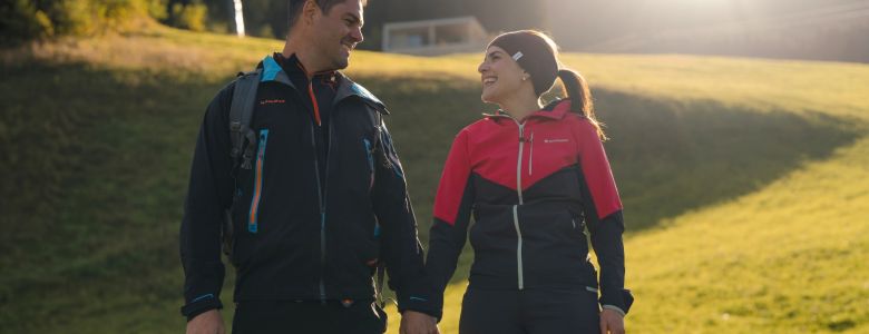 Couple hiking through the mountain landscape of Grossarl in Salzburger Land